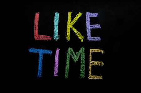 hand drawn colored words "liketime" on blackboardの写真素材