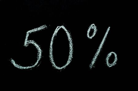 50%  hand drawn on chalkboardの写真素材