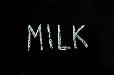 word "milk" drawn on chalkboardの写真素材