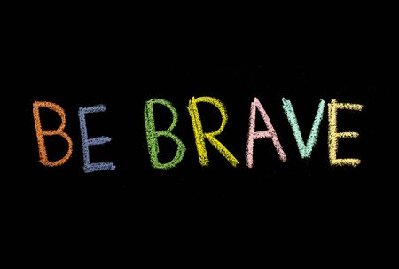"be brave" drawn on chalkboardの写真素材