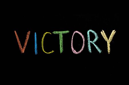 word "victory" drawn on chalkboardの写真素材