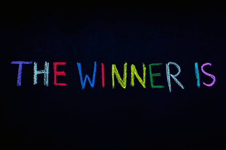colored text the winner is drawn on blackboardの写真素材