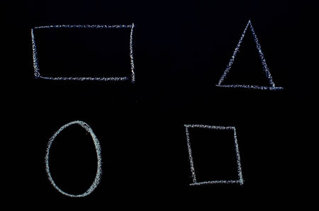 triangle, oval, square, parallelogram drawn on blackboardの写真素材