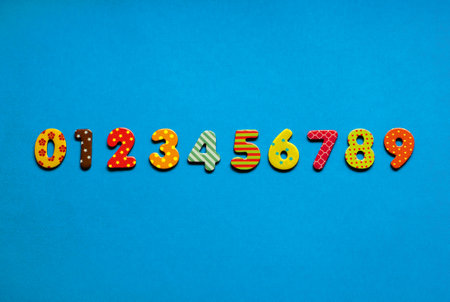 numbers from one to nine  one on blue paper backgroundの写真素材