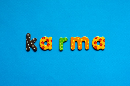 word karma on blue paper backgroundの写真素材