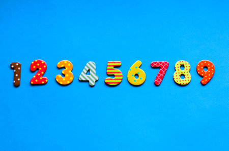 numbers from one to nine  one on blue paper backgroundの写真素材