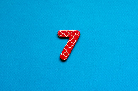 number seven on blue paper backgroundの写真素材
