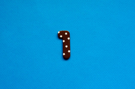 number one on blue paper backgroundの写真素材