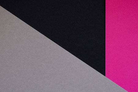 Colored geometric grey, black, pink paper texture backgroundの写真素材
