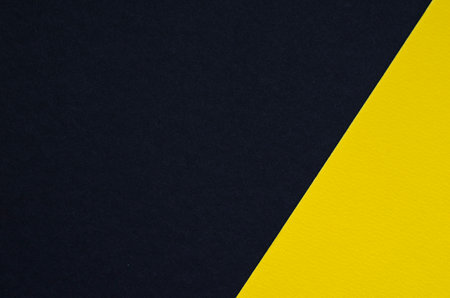 Colored geometric black and yellow paper texture backgroundの写真素材