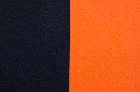 Colored geometric black and orange paper texture backgroundの写真素材