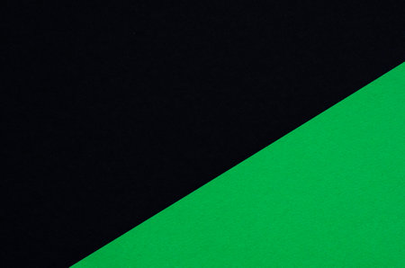 Colored geometric black and green paper texture backgroundの写真素材