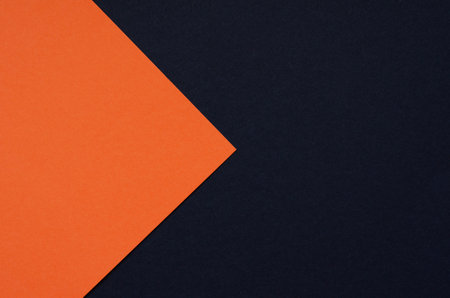 Colored geometric black and orange paper texture backgroundの写真素材