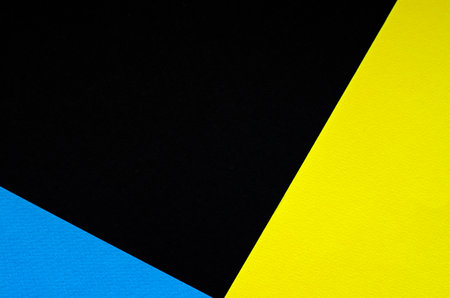 Colored geometric black, blue and yellow paper texture backgroundの写真素材
