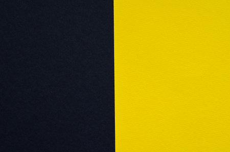Colored geometric black and yellow paper texture backgroundの写真素材