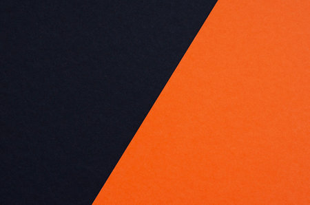 Colored geometric black and orange paper texture backgroundの写真素材