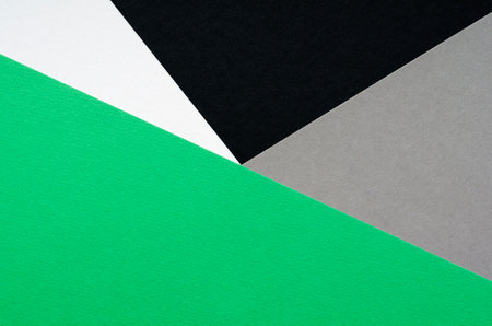 Color papers geometry composition background with light and dark green and black tonesの写真素材