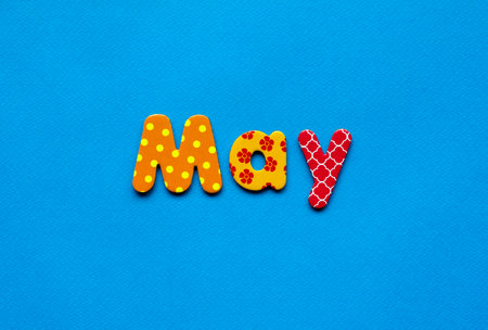 colored text May on blue paper backgroundの写真素材