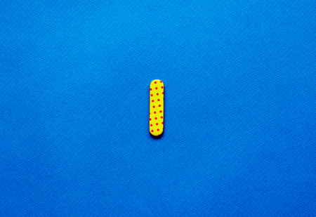 letter i on blue paper backgroundの写真素材