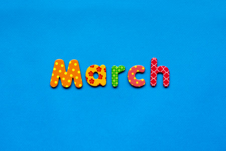 colored text March on blue paper backgroundの写真素材