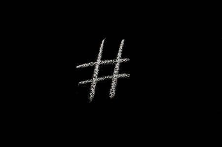 hash tag symbol drawn on blackboardの写真素材