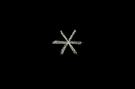asterisk symbol drawn on blackboardの写真素材