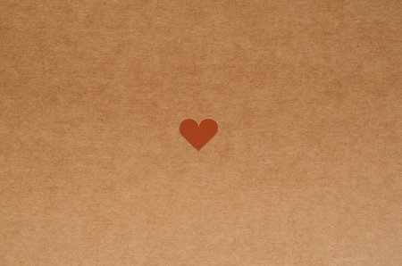 small cute heart on brown craft paper backgroundの写真素材