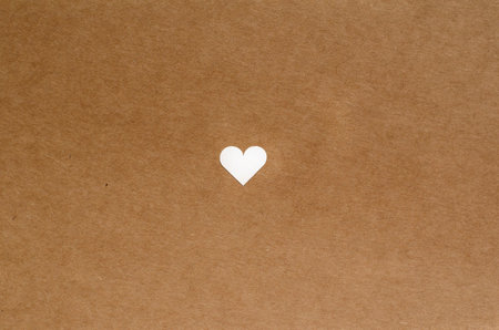small cute heart on brown craft paper backgroundの写真素材