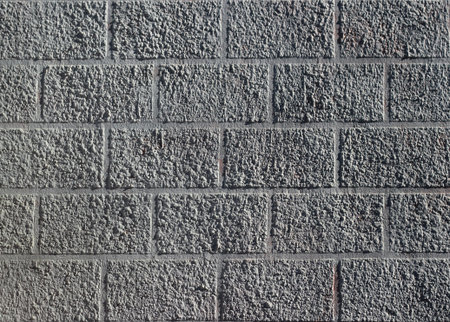 Abstract weathered texture stained old stucco light gray and aged paint brick wall background in...