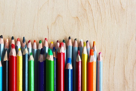 Multu colored pencils on light plywood backgroundの写真素材