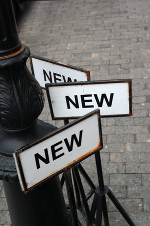 Metal sign plates with word NEWの写真素材