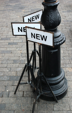 Metal sign plates with word NEWの写真素材