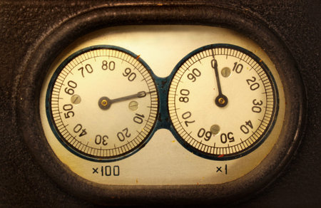 Old electromechanical counter - two dials and needles reading zerosの写真素材