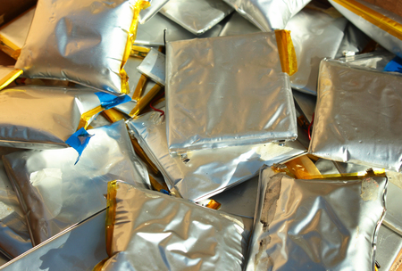 Swollen lithium polymer batteries. Dangerous and harmful electronic wasteの写真素材