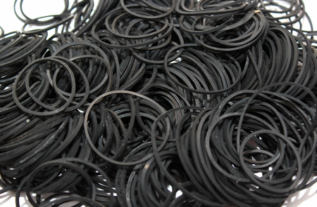 Many small black rubber beltsの写真素材