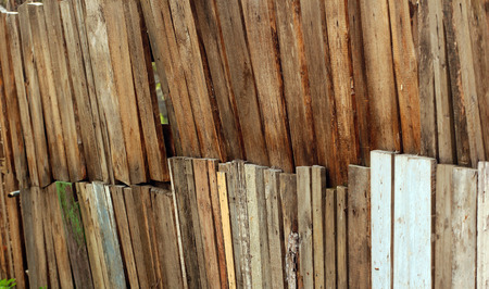 Old wooden fence. Focus is in the middleの写真素材