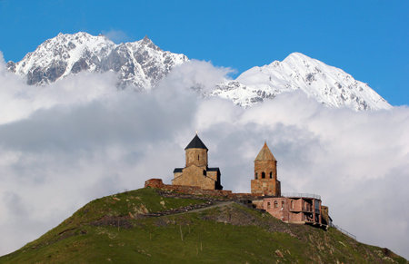 Gergeti christian church near Kazbegi, Stepantsminda village in Georgia, Caucasus.