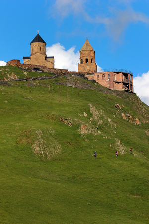 Old Gergeti christian church near Kazbegi, Stepantsminda village in Georgia, Caucasus mountainsの写真素材