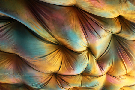 Dirty suspended ceiling. Grungy colors of old saggy drapingsの写真素材