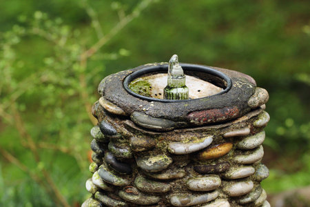 Old drinking water fountain in a park