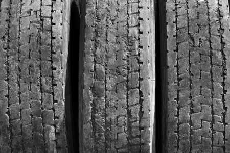 Old worn used car tires closeupの写真素材