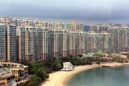 HONG KONG, MARCH 5, 2012: Park Island apartment complex and Ma Wan Tung Wan Beach on Ma Wan island in Tsuen Wan, New Territories, Hong Kong. Residential buildings often occupy beaches and coastal regions.のeditorial素材