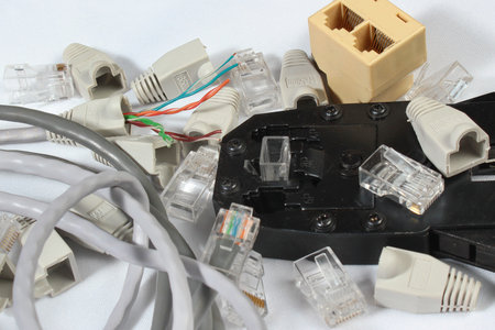Crimping tool for twisted pair network cable with connectors and caps