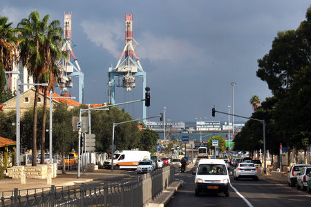 HAIFA, ISRAEL - DECEMBER 4,2013: Cranes at Haifa port seen from central Ben Gurion boulevard in downtown city. Haifa is the third-largest city in Israel and major tourist destination.のeditorial素材