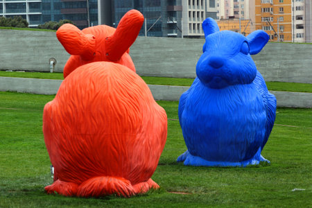 BAKU, AZERBAIJAN - APRIL 24, 2017: Big colorful rabbits on green lawn as elements of landscape design near Heydar Aliyev Center, the building designed by world-famous architect Zaha Hadid.のeditorial素材