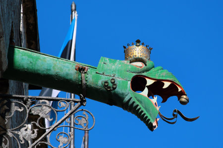 TALLINN, ESTONIA - JULY 7, 2017: Rain gutter decorated with dragon gargoyle head on the Town Hall of Tallinn, the oldest town hall in the whole of the Baltic region and Scandinavia.のeditorial素材
