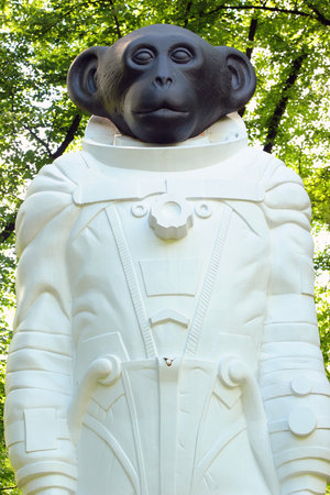 RIGA, LATVIA - JULY 10, 2017: Sculpture of a monkey in spacesuit in Kronvalda park. Statue "Sam" from the series "First Crew" by Denis Prasolov, dedicated to animals that participated in exploration of outer space.のeditorial素材