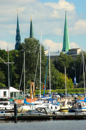 RIGA, LATVIA - JULY 10, 2017: Yachts and motorboats at Andrejosta yacht club. Ships were historically moored here, hidden from waves and wind in Daugava river basin.のeditorial素材