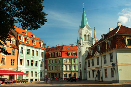 RIGA, LATVIA - JULY 10, 2017: Castle Square and Our Lady of Sorrows Church in the Riga Old Town, UNESCO World Heritage Site and popular tourist destination.のeditorial素材
