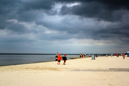 JURMALA, LATVIA - JULY 11, 2017: Jurmala, a seaside resort town on the Gulf of Riga with long stretch of white-sand beach, popular among Latvians and tourists. Summer day with dark overcast sky and low clouds.のeditorial素材